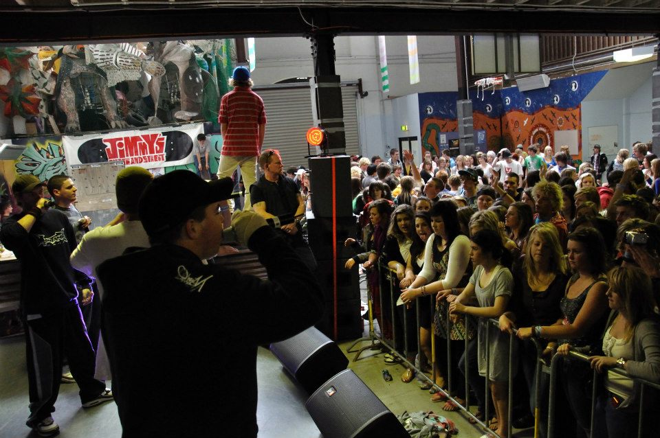 Crowd watching MC performing on stage